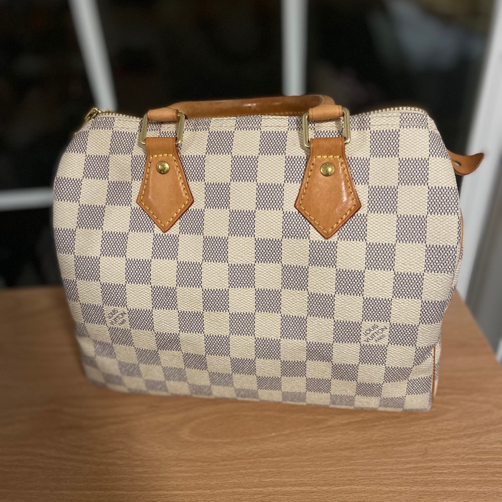 Speedy *posh can authenticate this purse for you.